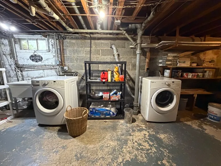 Washer/Dryer conveniently located in basement with extensive additional storage space