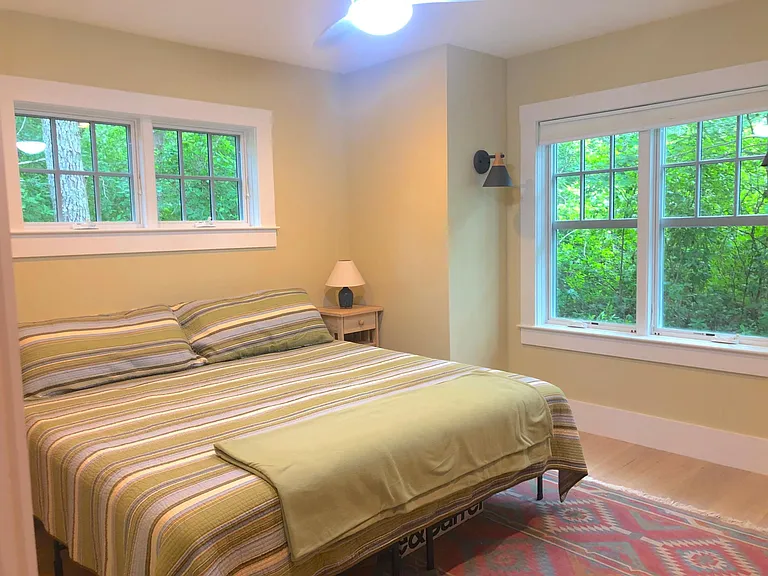 first floor bedroom with king bed