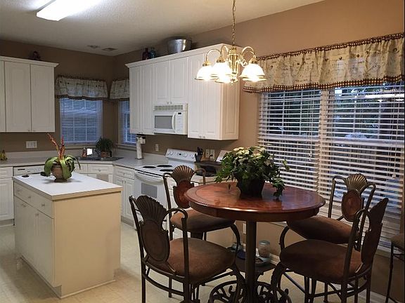 Eat in Kitchen with lots of storage and pantry. Laundry roo