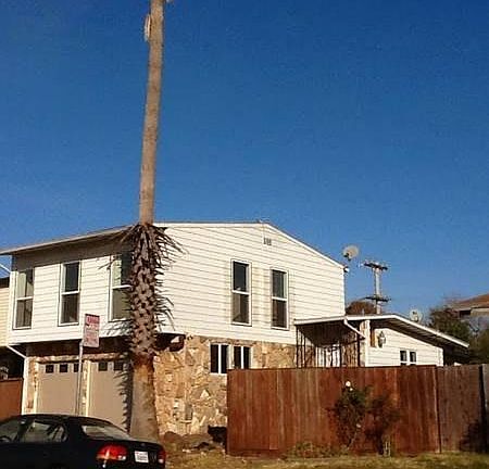 Exterior Side (Palm Tree Removed After Photo Taken)
