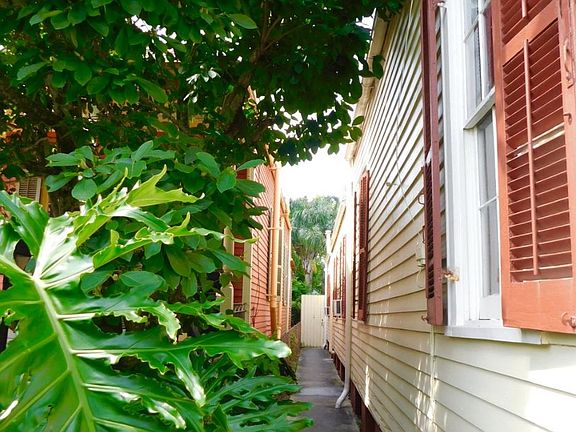 Walkway along house to entrance via a private patio. Automa