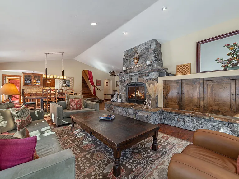 Great room with gas fireplance and large retractable TV inside cabinets with surround sound