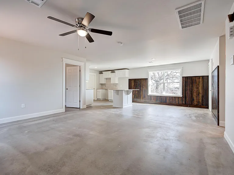 large open floor plan with all concrete floors- 1163 sq ft