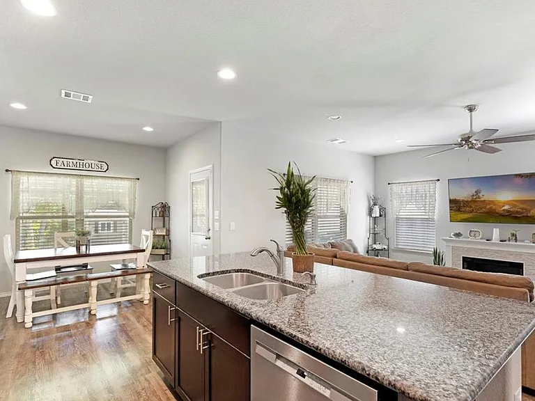 LOTS OF SPACE FOR YOUR FAMILY TO GATHER, INCLUDING BAR SEATING AT THE HUGE GRANITE ISLAND!
