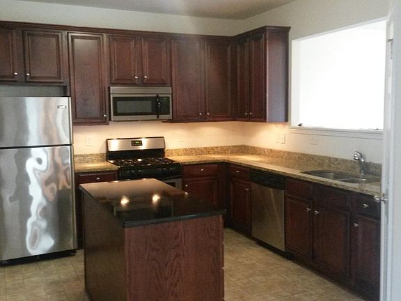Kitchen with granite countertops and island