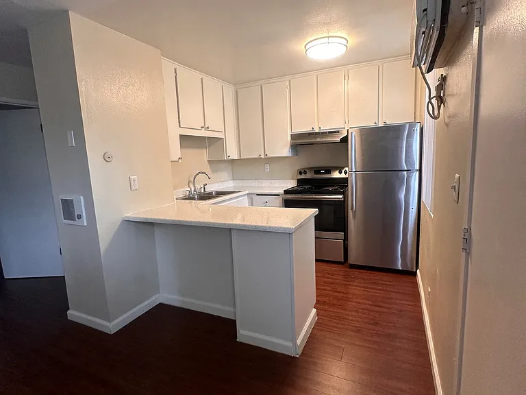 Kitchen view at The Meadowlark Apartments in San Marcos, CA.