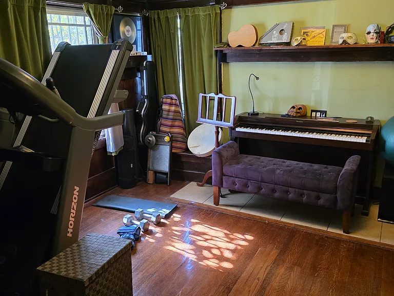 Music / workout room with futon for overnight guests