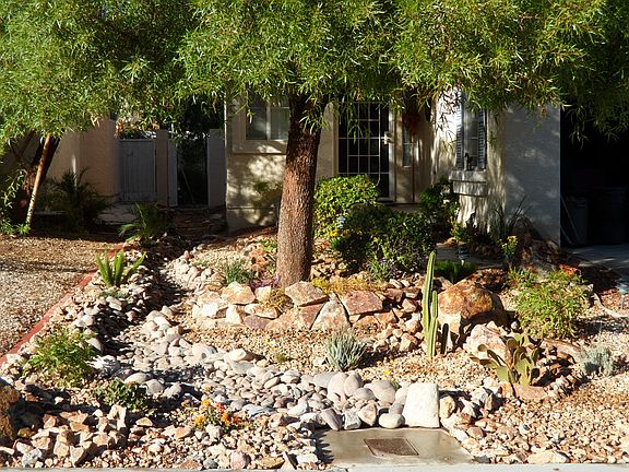 Maintance free front yard with sprinkler system.