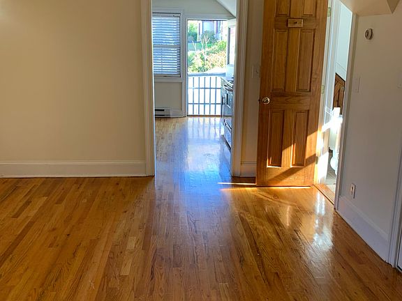 Living Room view to Main Entrance and Kitchen