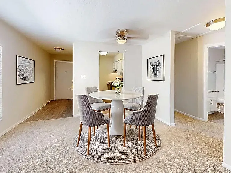 Inviting dining space with a modern round table, elegant chairs, and tasteful decor, perfect for intimate gatherings.
