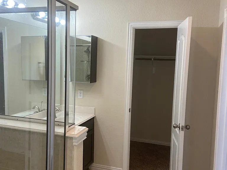Master bath - right side with first closet in the restroom