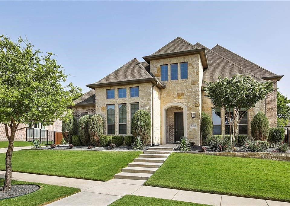 1386FrancieWay.com  Stunning stone and brick elevation on this beautiful home with attractive drought tolerant landscaping.