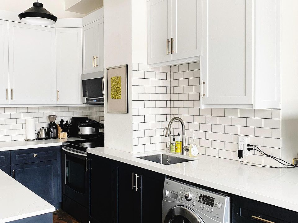 Custom renovated kitchen and island with in-unit washer/dryer