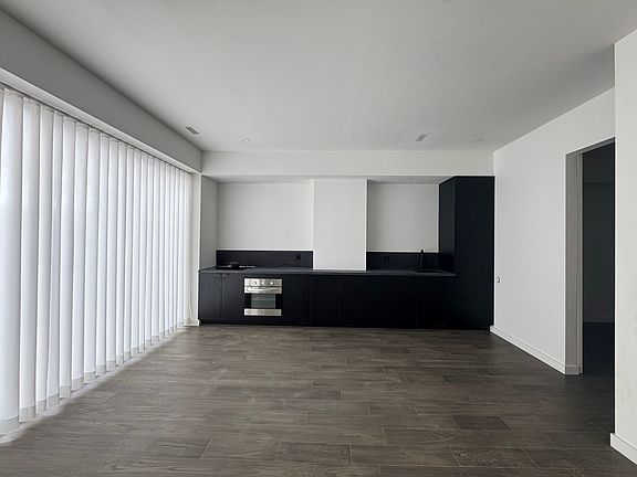 view of principal living area with drapes closed
