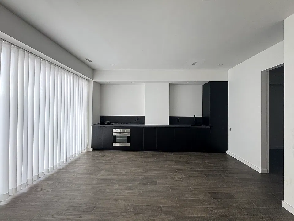 view of principal living area with drapes closed