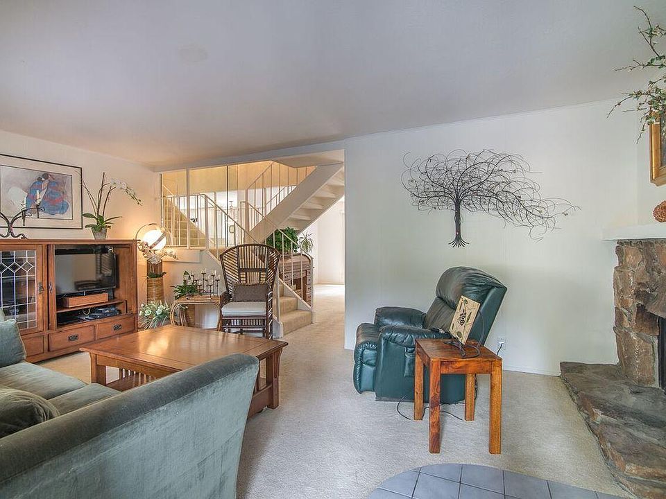 living room with wood burning fireplace