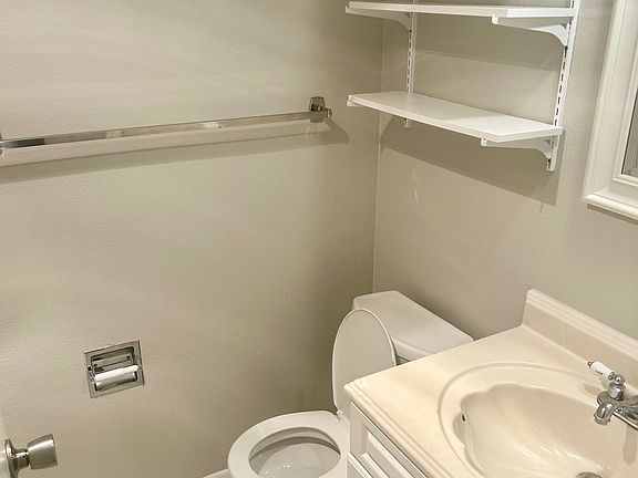 White and bright bathroom, with full size vanity.
