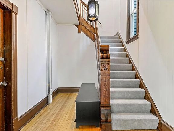 Shared Entry way. Unit one is door on left, unit two is up the stairs