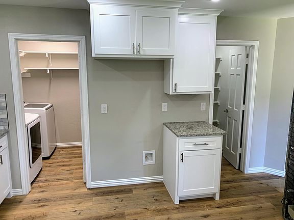 Laundry and large walk-in pantry in kitchen. Room for large side-by-side refrigerators.