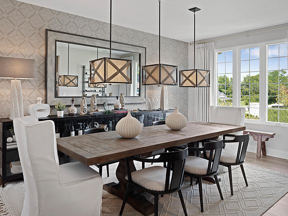 dining room with three pendant lights above table