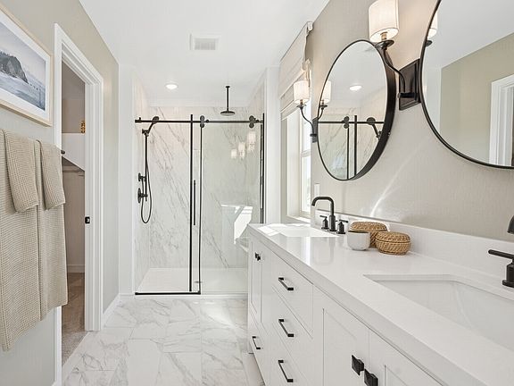 Primary bath with glass shower enclosure