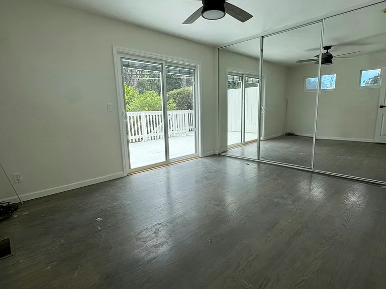 Primary bedroom w/ access to deck