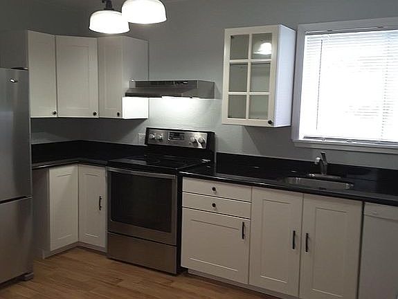 new cabinets, sink, faucet and granite counters