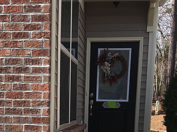 Main Entrance Door with Privacy Glass and Rain protection Cover over door. Front has brick appearance
