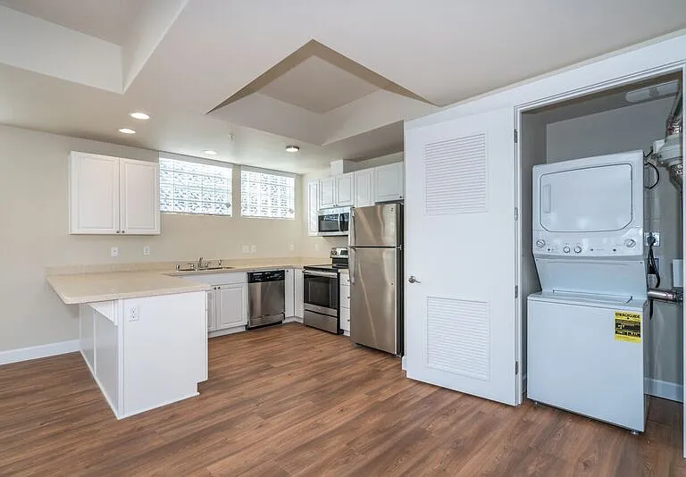 Stainless steel appliances and stackable washer and dryer in the home!