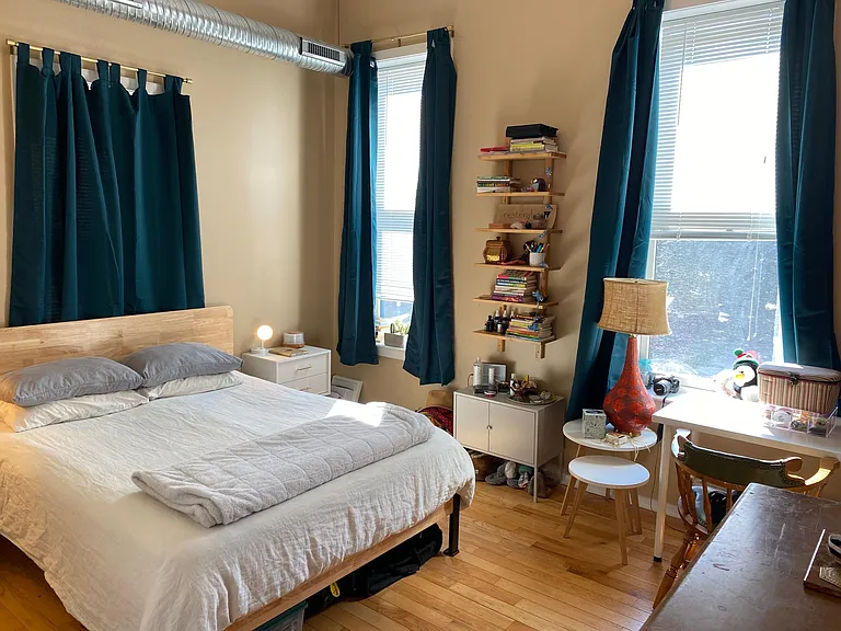 Larger bedroom with front facing windows to Kenwood Ave.