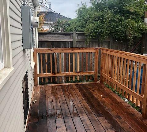 Back yard-fenced, new deck yard with room for a fenced car with additional outside parking