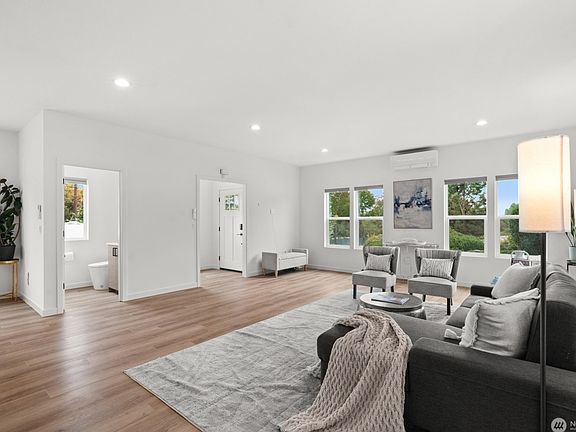 Living room, entry foyer and powder room.