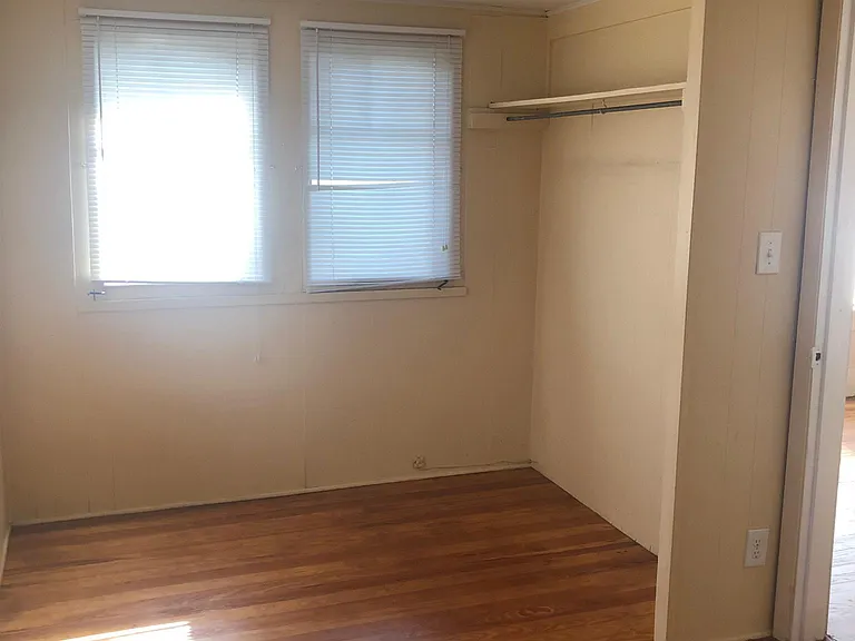 Additional bedroom area with clothes hanging space
