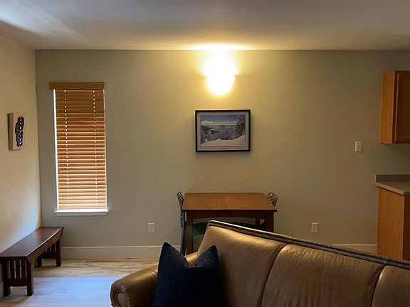 From living room facing entry and dining area
