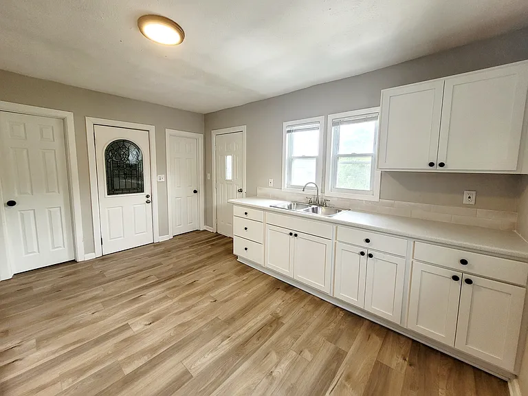 Kitchen with private entrance off of rear parking pad