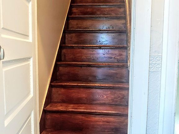 Open door to 13 steps to 3rd floor unit.