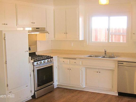 Large, Open, Bright Kitchen with New Stainless Steel Stove and Dishwasher