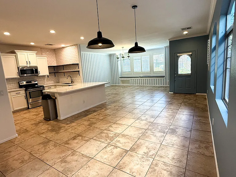 Open dining space with seamless flow to the kitchen and living room.
