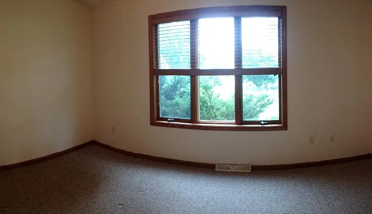 primary 1st floor bedroom facing rear yard
