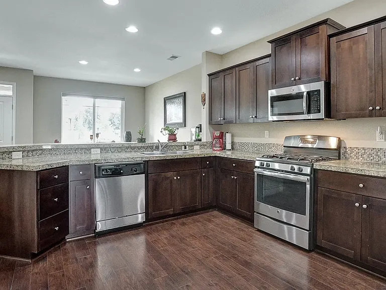 Spacious kitchen with lot of cabinets and pantry
