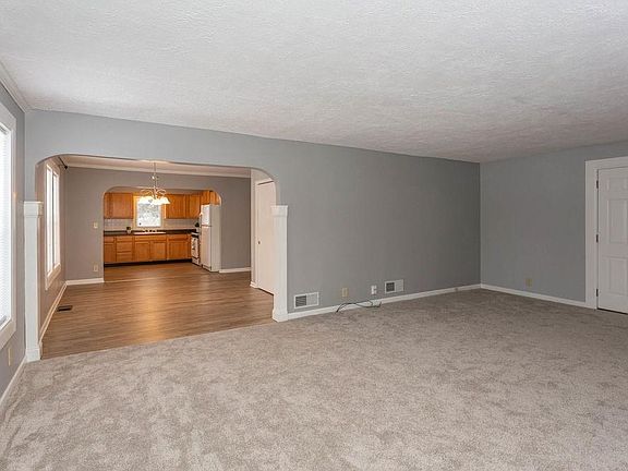 View from Living Room into Dining Room and Kitchen beyond.