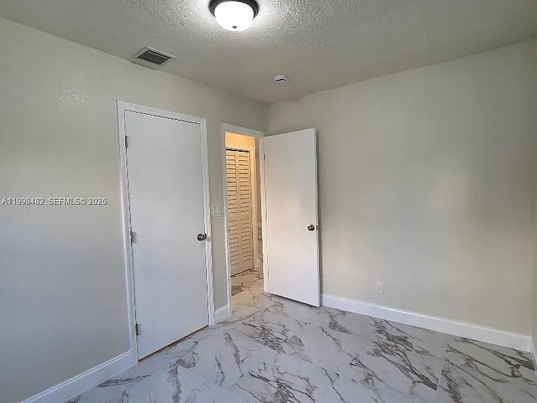 295 NW 48th St — Photo 11