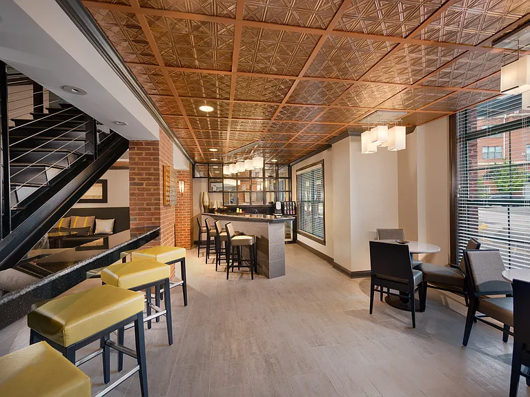 Stylish Resident Lounge with Fireplace, Wet Bar, and Plush Seating Areas