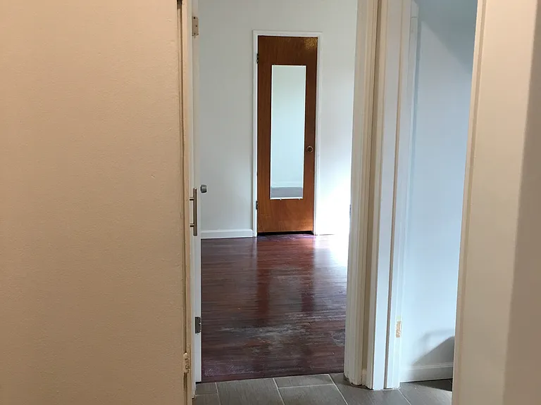 Hallway view into 2nd bedroom