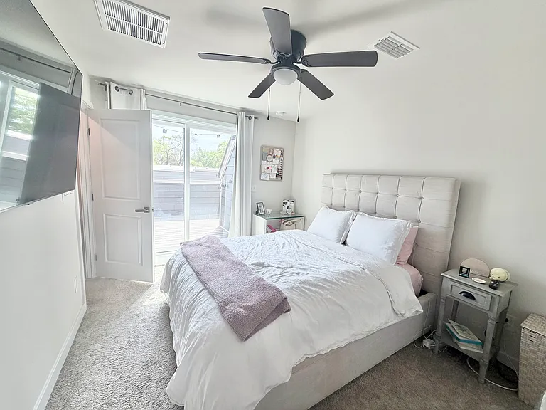 3rd bedroom with attached full bathroom, closet and larger slider door to private rooftop terrace