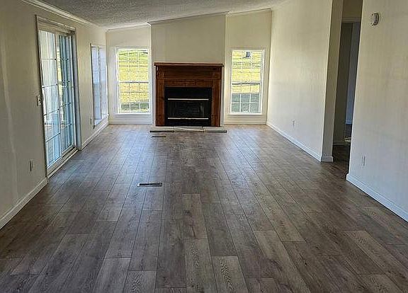 Open floor plan with breakfast room right off kitchen and cozy family room with sliding door to deck.
