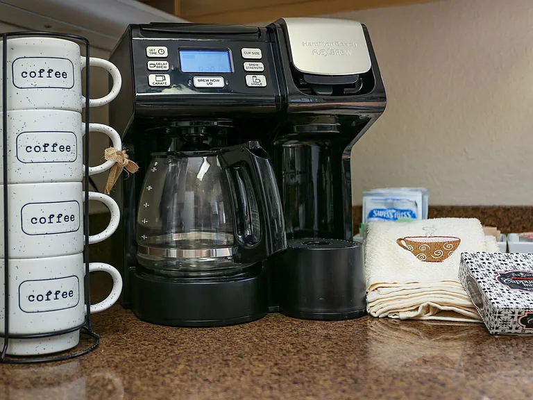 Furnished with kitchen supplies and necessities like a coffee pot. :)