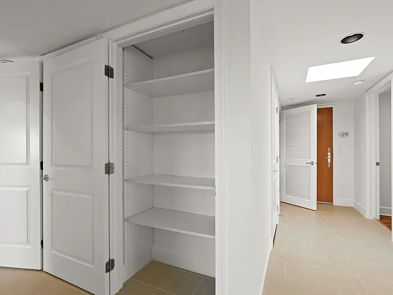 Hall Closet with Built-In Shelving