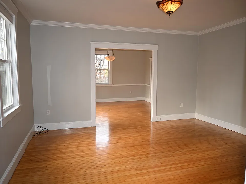 Living room with view into dining room