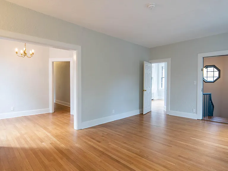 Living room, dining room to the left, bedroom 3 and entry door to the right.